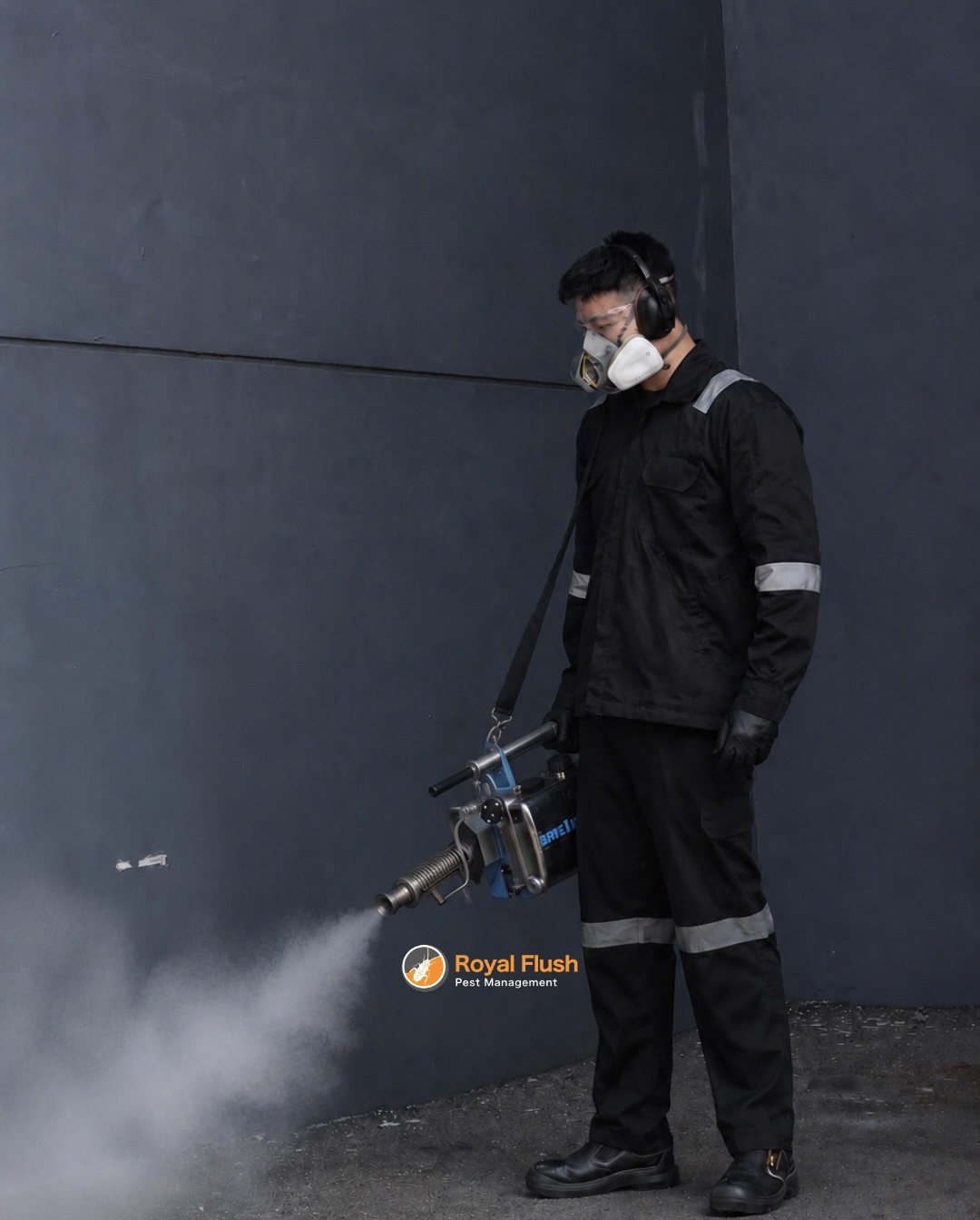 Royal Flush technician in full protective gear thermal fogging